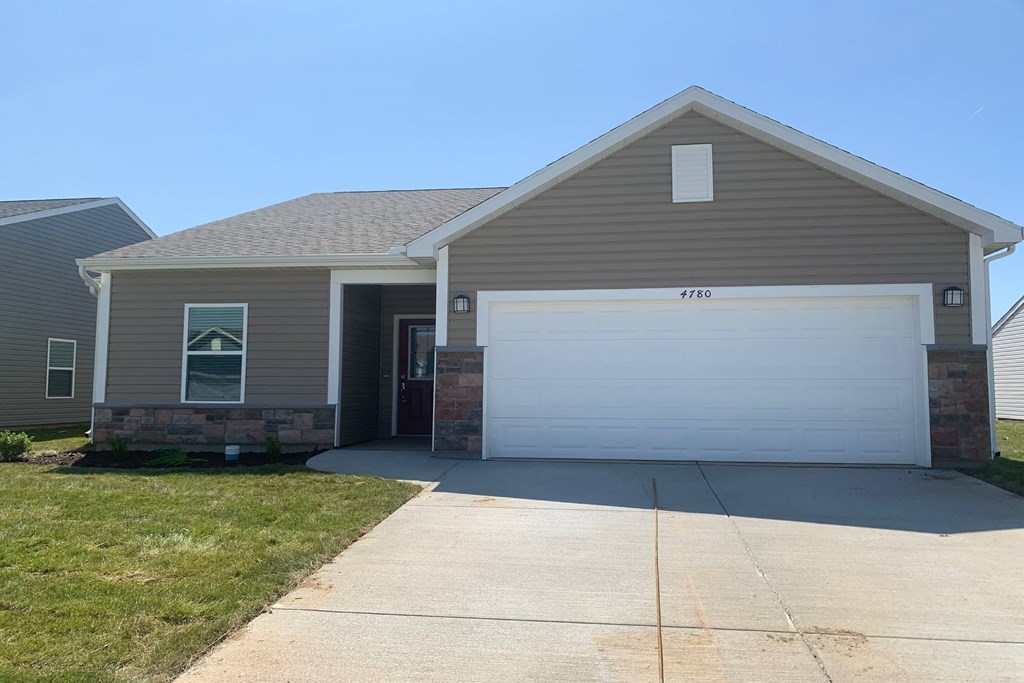 a home with a white garage door